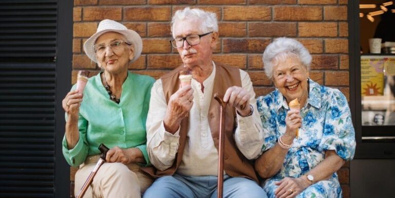 Elderly Residents Enjoy Ice Cream Treats Together at Memory Care Facility