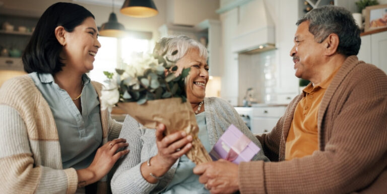 Young Woman Emotionally Connecting with Senior Woman at Memory Care Facility