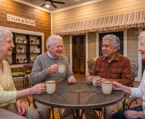 Elderly Residents Socializing Over Coffee at a Memory Care Community Elderly Residents Socializing Over Coffee at a Memory Care Community