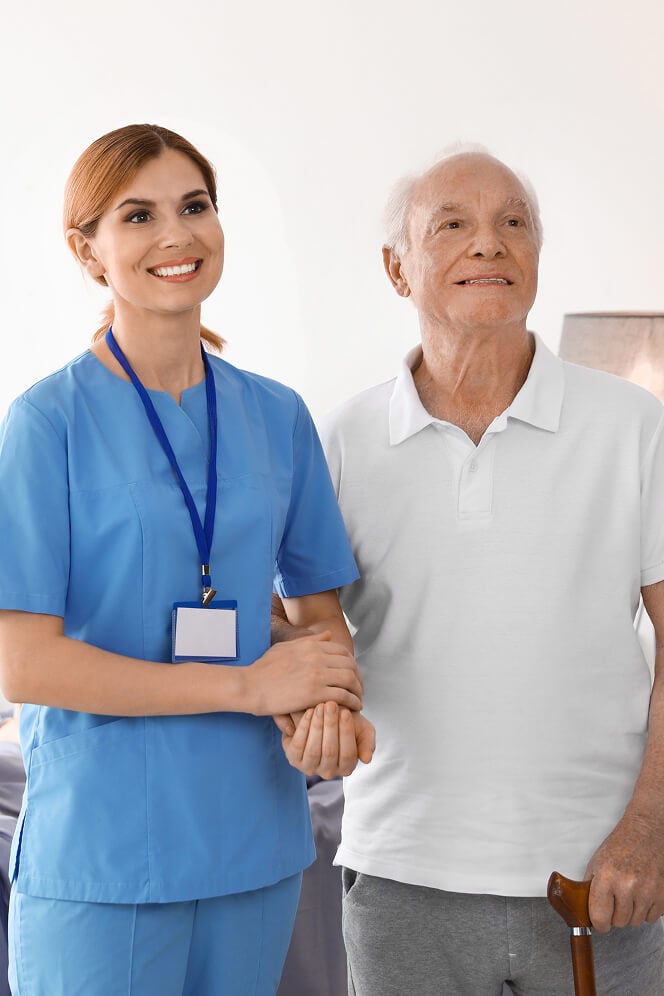Nurse Comforting Elderly Woman at Nursing Home Colleyville