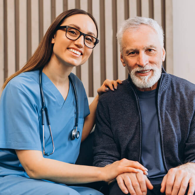 Caregiver Comforting Resident at Memory Care Facility